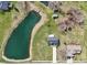 Areal view of two-story house with pond and outbuildings sitting on a large lot at 12121 N Berling Dr, Mooresville, IN 46158