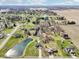 Desirable neighborhood featuring a two-story house, large yards, and a tranquil pond at 12121 N Berling Dr, Mooresville, IN 46158