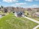 Aerial view of a residential property, featuring a spacious yard, shed, and surrounding landscape at 12121 N Berling Dr, Mooresville, IN 46158