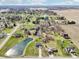 Desirable neighborhood featuring a two-story house, large yards, and a tranquil pond at 12121 N Berling Dr, Mooresville, IN 46158
