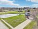 Aerial view of a home, showcasing its landscaping, pond, and neighborhood surroundings at 12121 N Berling Dr, Mooresville, IN 46158