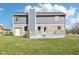 The backyard of the home features a spacious lawn and a multi-level deck at 12121 N Berling Dr, Mooresville, IN 46158