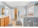 Light filled bathroom with tile floors, a large soaking tub and walk in shower at 12121 N Berling Dr, Mooresville, IN 46158