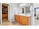 Bright bathroom featuring a double vanity and a large walk-in closet at 12121 N Berling Dr, Mooresville, IN 46158