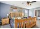 Bedroom with a wooden bed frame, tray ceiling, neutral walls, and a sitting area in the background at 12121 N Berling Dr, Mooresville, IN 46158