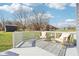 Cozy outdoor deck furnished with comfortable chairs and stylish outdoor rug, perfect for relaxation at 12121 N Berling Dr, Mooresville, IN 46158