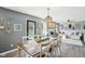 Open concept dining room featuring seating for six and lots of natural light at 12121 N Berling Dr, Mooresville, IN 46158