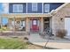 Charming brick front porch with wooden columns and cozy seating area at 12121 N Berling Dr, Mooresville, IN 46158