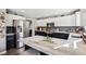 A kitchen island is in focus and features ample counter space and seating at 12121 N Berling Dr, Mooresville, IN 46158