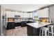 The kitchen features an island, lots of countertop space, and stainless steel appliances at 12121 N Berling Dr, Mooresville, IN 46158