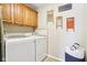 Efficient laundry area with modern appliances and custom cabinets, for easy chore days at 12121 N Berling Dr, Mooresville, IN 46158