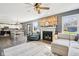 Spacious living room showcasing an open layout, fireplace, and seamless transition to the dining area at 12121 N Berling Dr, Mooresville, IN 46158