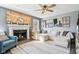 Bright living room featuring a fireplace, sectional sofa, and charming decor with natural light at 12121 N Berling Dr, Mooresville, IN 46158