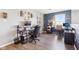 Open office space featuring dual workstations, modern decor, and hardwood flooring throughout at 12121 N Berling Dr, Mooresville, IN 46158