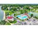 Aerial view of the community pool, playground, and clubhouse showcasing the neighborhood amenities at 12307 Pebblepointe Pass, Carmel, IN 46033