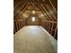 Unfinished attic space with wood beams, exposed studs and plywood flooring at 12307 Pebblepointe Pass, Carmel, IN 46033