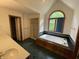 Bright bathroom with jetted tub under arched window, walk-in closet, and double sink vanity at 12307 Pebblepointe Pass, Carmel, IN 46033