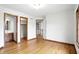Spacious bedroom boasts hardwood floors and convenient access to a bathroom and closet at 12307 Pebblepointe Pass, Carmel, IN 46033