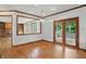 Charming dining area with hardwood floors, built-in shelving, and access to an outdoor space at 12307 Pebblepointe Pass, Carmel, IN 46033