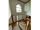 Bright foyer with hardwood floors, large window, and elegant chandelier creating a welcoming entrance at 12307 Pebblepointe Pass, Carmel, IN 46033