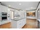 A kitchen with granite countertops, a central island, and stainless steel appliances at 12307 Pebblepointe Pass, Carmel, IN 46033