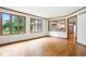Living room with many windows looking to the backyard and wood trim at 12307 Pebblepointe Pass, Carmel, IN 46033