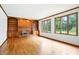 Spacious living room with built-in shelves and cabinets around a brick fireplace at 12307 Pebblepointe Pass, Carmel, IN 46033
