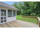 Wooden deck overlooking large backyard and screened in patio, perfect for outdoor enjoyment at 12307 Pebblepointe Pass, Carmel, IN 46033