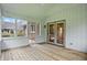 Relaxing screened porch with wood floors and adjacent views of the beautiful backyard at 12307 Pebblepointe Pass, Carmel, IN 46033