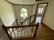 Elegant staircase with wood railing and plush carpeting leads to upper level, with large window for light at 12307 Pebblepointe Pass, Carmel, IN 46033