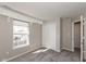 This bedroom features plush carpeting, a window, and a closet with folding doors at 15405 Fawn Meadow Dr, Noblesville, IN 46060