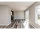 Bright dining room with sliding glass doors and modern gray flooring at 15405 Fawn Meadow Dr, Noblesville, IN 46060