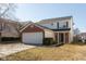 Two-story home featuring brick and siding, attached two car garage, and manicured lawn at 15405 Fawn Meadow Dr, Noblesville, IN 46060