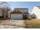 Two-story home featuring brick and siding, attached two car garage, and manicured lawn at 15405 Fawn Meadow Dr, Noblesville, IN 46060