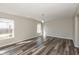 Bright living room with modern gray flooring and neutral walls at 15405 Fawn Meadow Dr, Noblesville, IN 46060