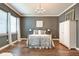 The bedroom has hardwood floors, large windows for natural light, and chandelier at 1591 W 151St St, Westfield, IN 46074