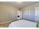 Simple bedroom with an open doorway providing a glimpse into another room, and light-colored walls at 1591 W 151St St, Westfield, IN 46074