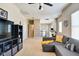 Bonus room with exercise equipment, gray couch, and an adjacent room at 1591 W 151St St, Westfield, IN 46074