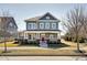 Charming two-story home featuring a inviting front porch, well-manicured lawn and appealing curb appeal at 1591 W 151St St, Westfield, IN 46074