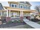 Charming covered porch with brick accents and white railing, providing a welcoming entrance at 1591 W 151St St, Westfield, IN 46074