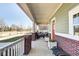 Charming front porch with brick accents and comfortable seating perfect for relaxing and enjoying the outdoors at 1591 W 151St St, Westfield, IN 46074