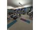 Bright community gym featuring cardio equipment, including ellipticals and treadmills, with TVs at 1591 W 151St St, Westfield, IN 46074