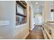Hallway with built-in shelving and an arched entryway offering a blend of functionality and architectural detail at 1591 W 151St St, Westfield, IN 46074