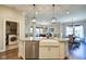 Kitchen island featuring a farmhouse sink, stainless steel dishwasher, and granite countertops for a modern touch at 1591 W 151St St, Westfield, IN 46074