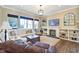 Comfortable living room with a fireplace, white sofa, and built-in shelving creating a cozy atmosphere at 1591 W 151St St, Westfield, IN 46074