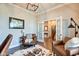 Office/Den featuring hardwood floors, french doors, and a view of the home's staircase at 1591 W 151St St, Westfield, IN 46074