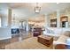 Bright, open-concept living space with a dining area, kitchen, and cozy living room, ideal for entertaining at 1591 W 151St St, Westfield, IN 46074