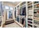 Spacious walk-in closet with ample shelving, mirror, and bench at 1591 W 151St St, Westfield, IN 46074