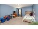 This bedroom features a charming blue wall, wooden furniture, soft carpet, and a window at 1773 Winchester Blvd, Avon, IN 46123