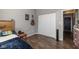 Bedroom with wood flooring, closet and guitar on the wall at 1773 Winchester Blvd, Avon, IN 46123